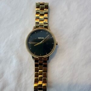 Nixon Gold and Black Timepiece